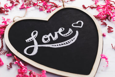 love written on a heart-shaped blackboard
