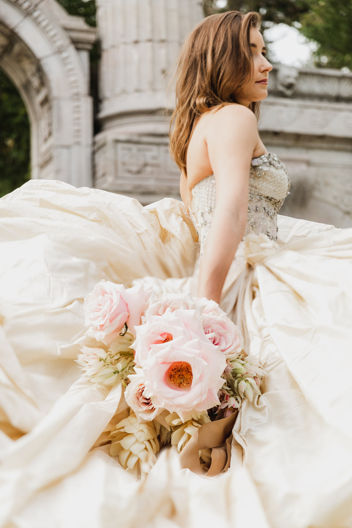 low angle of bride holding flowers