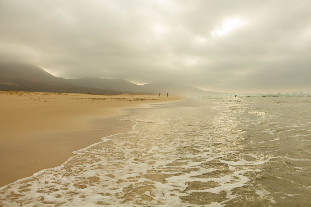 low clouds along sandy beach