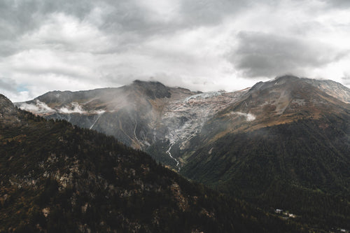 low clouds cascading over mountains and a valley