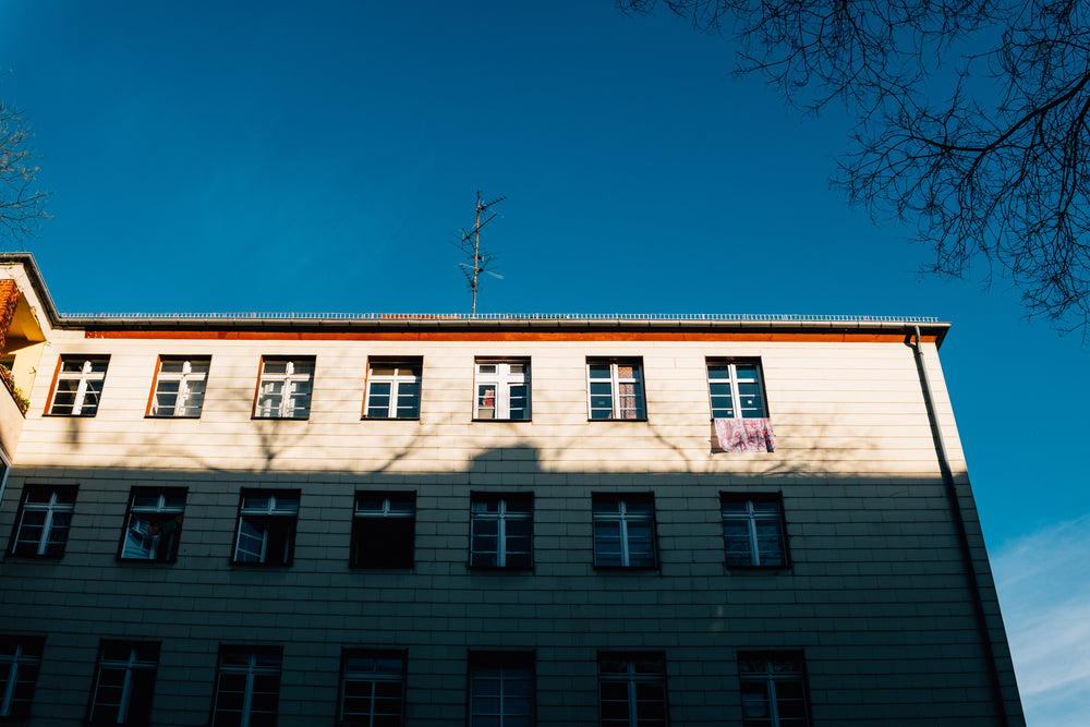 lowrise building under a deep blue sky