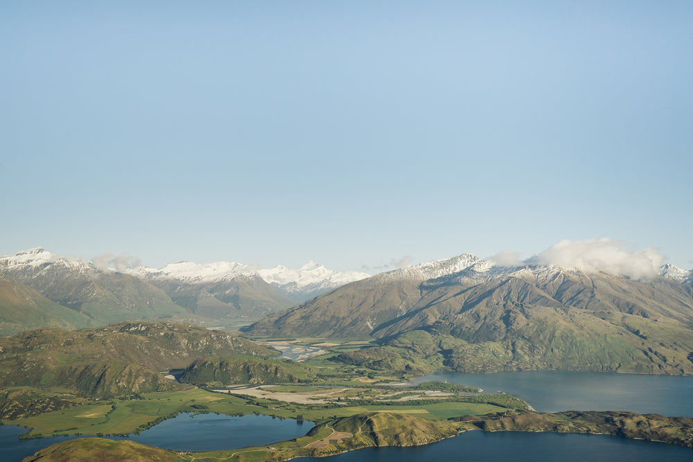 lush green mountains with snowy peaks