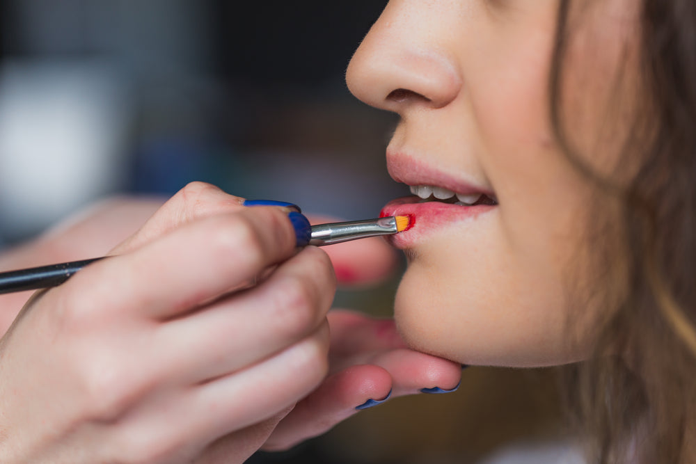 makeup artist applies makeup