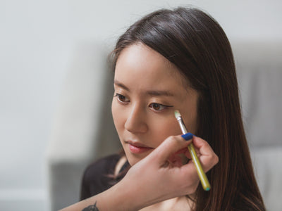 Makeup Artist Using Brush