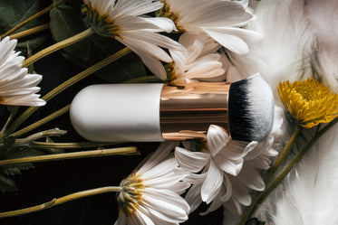 makeup brush in flowers