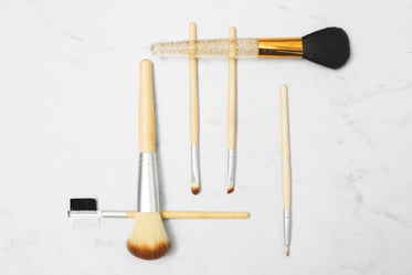 makeup brushes on marble