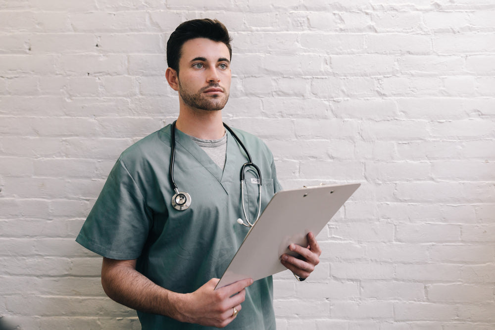 male doctor holding clipboard