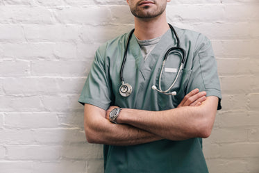 male doctor standing with arms crossed