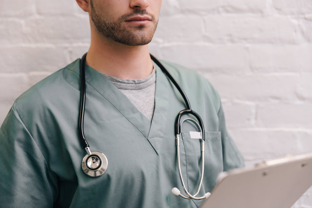 male doctor with stethoscope and clipboard