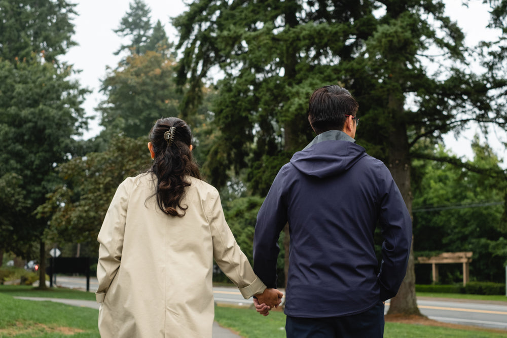 man and woman holding hands on a relaxing walk