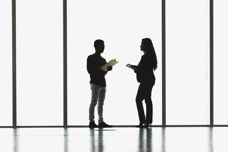 man-and-woman-meeting-in-front-of-large-windows.jpg?width=746&format=pjpg&exif=0&iptc=0