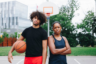 man and woman together on the court