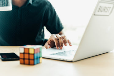 man at computer using trackpad