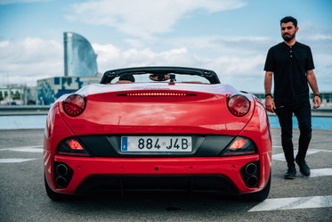 man beside euro sports car