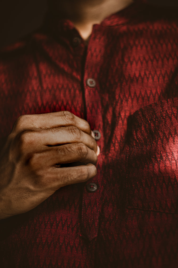 man-buttoning-a-dark-red-shirt.jpg?width=746&format=pjpg&exif=0&iptc=0
