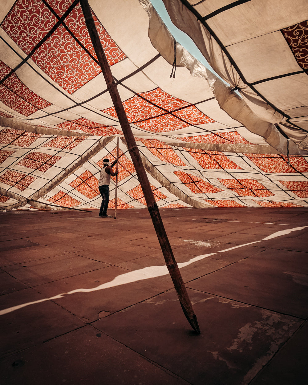 man constructing a canopy