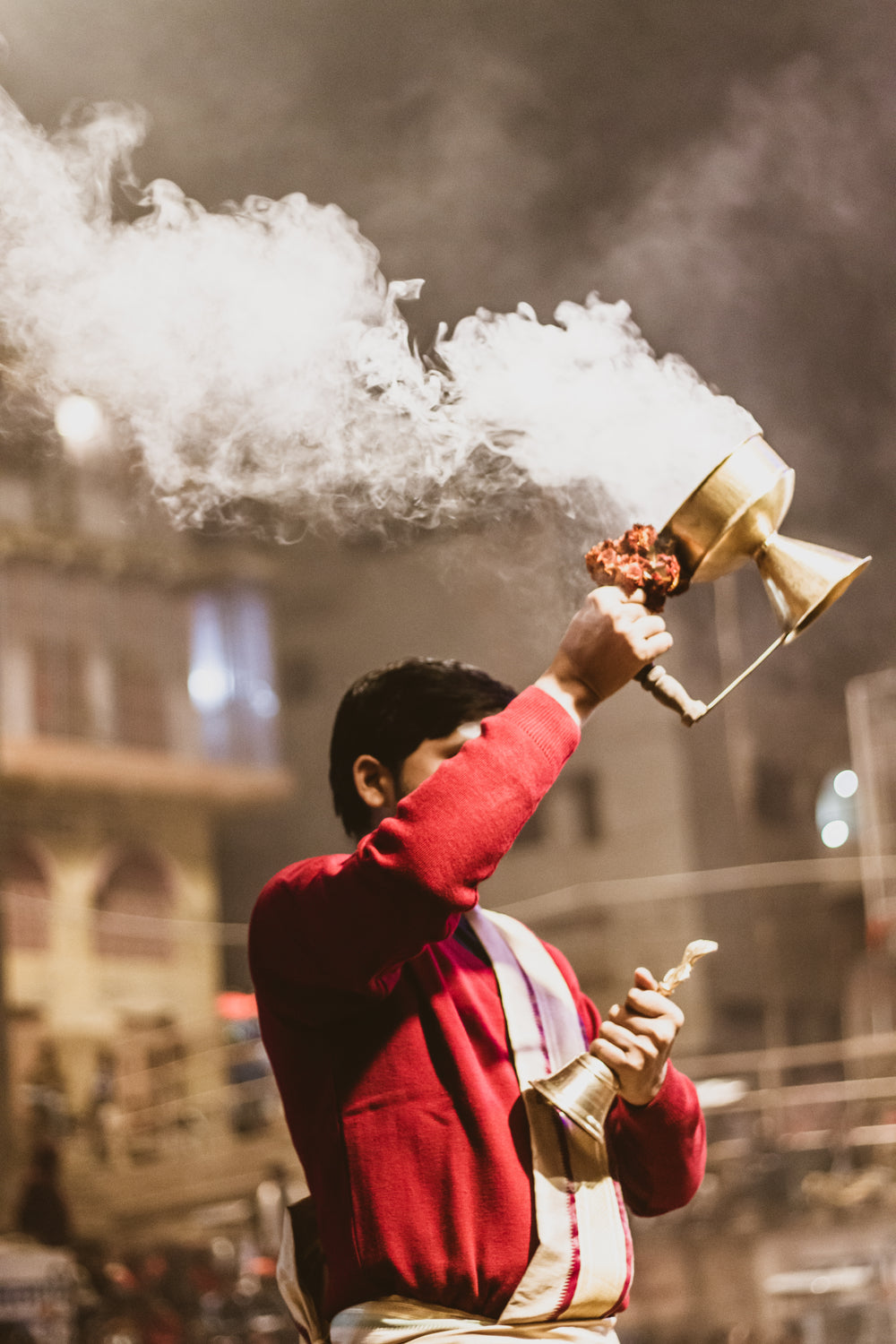 man creates cloud of smoke