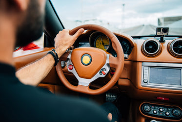 man driving in car interior