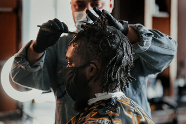 man getting a hair cut at local barber