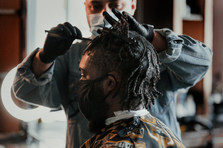 Man Getting A Hair Cut At Local Barber