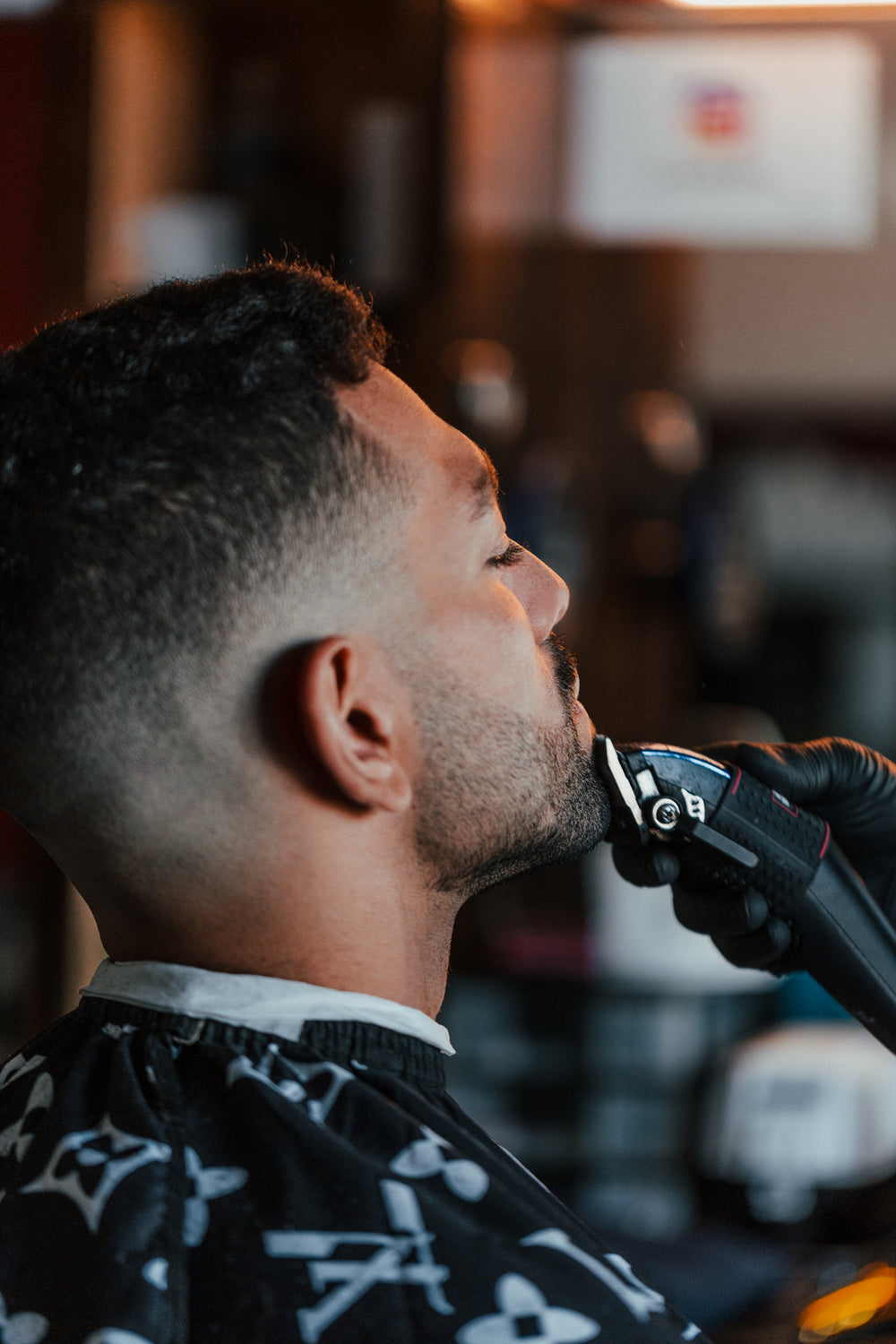 man getting his beard trimmed by barber