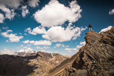 man-goat climbing rocks