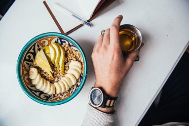 man hand with tea and granola