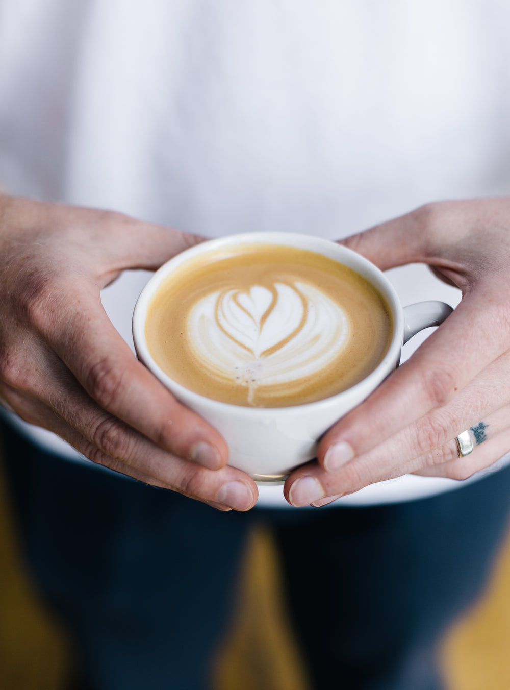 man holding a latte