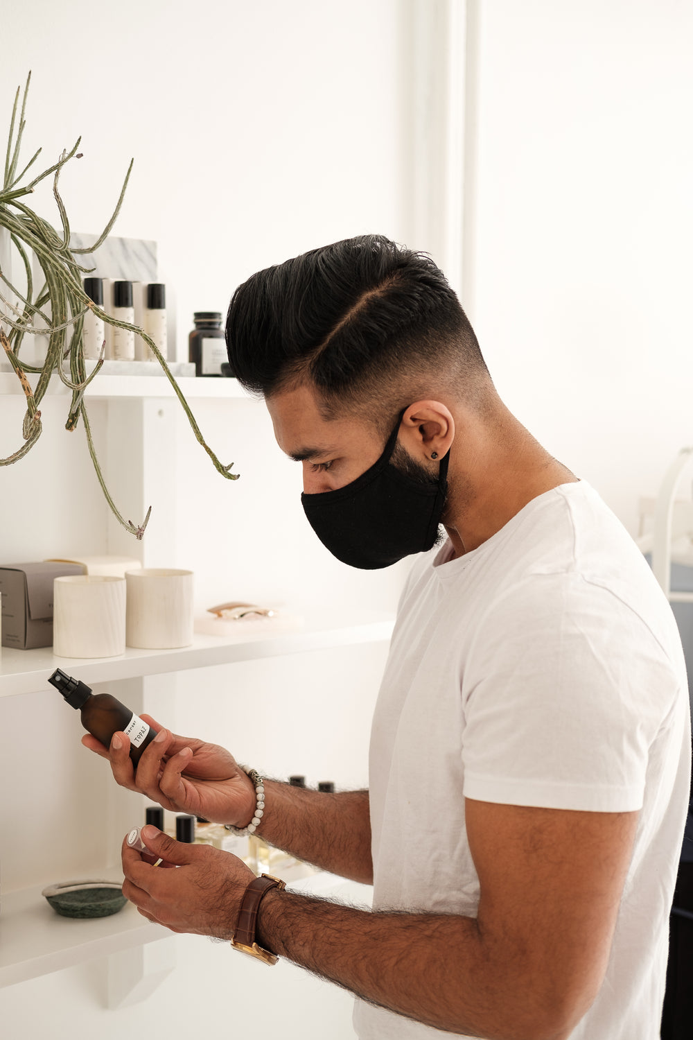man in black face mask browsing