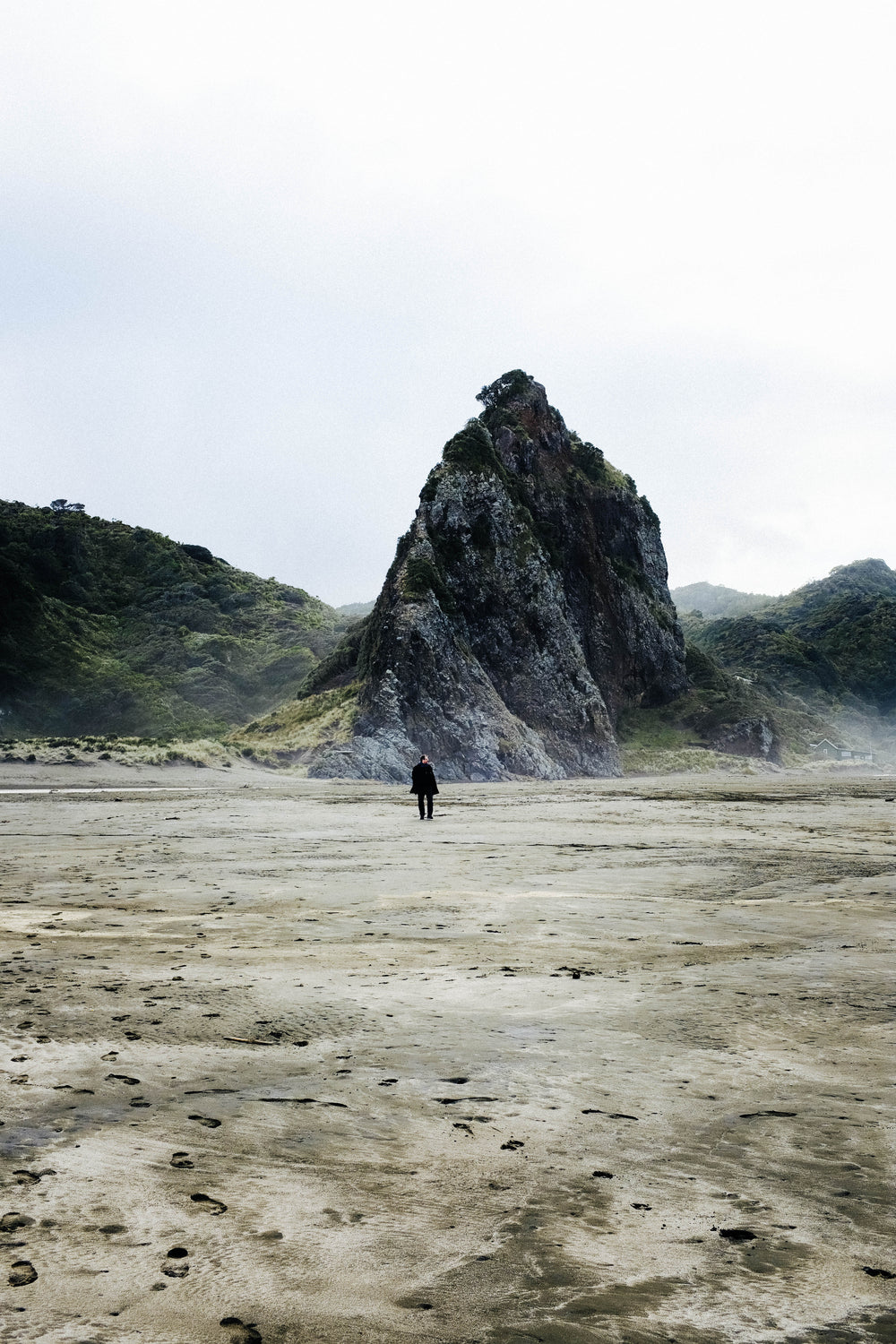 man in black on the beach