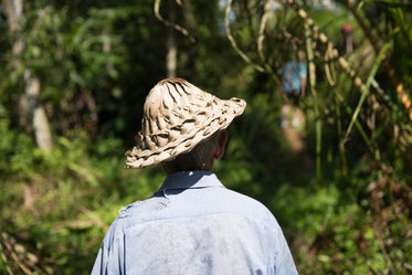 man in grass hat