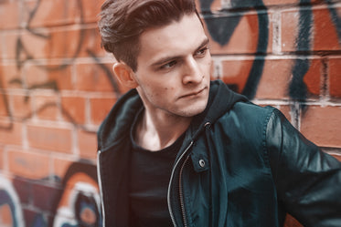 Picture of Man In Leather Graffiti Bricks — Free Stock Photo