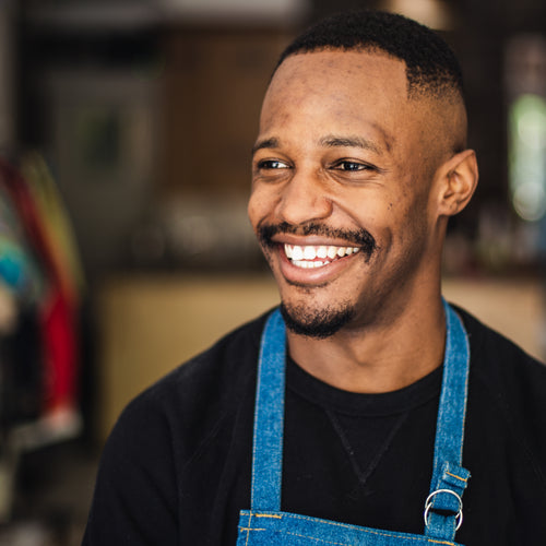 Man In Retail Store With Big Smile