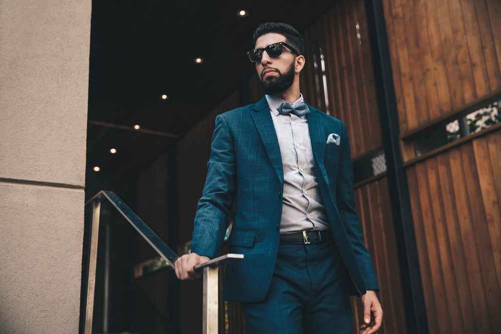 man in suit on stairs