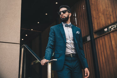 man in suit on stairs