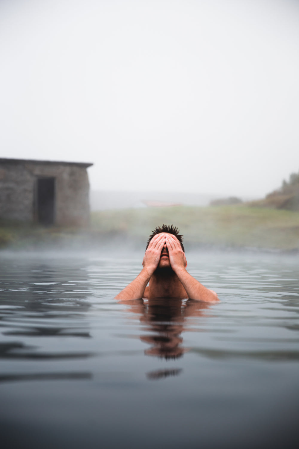 man in volcanic pool