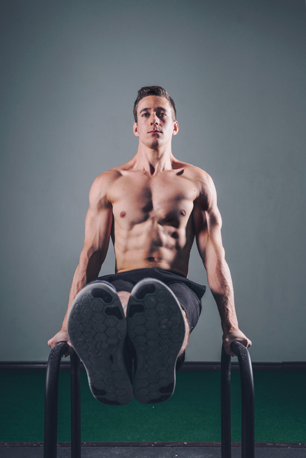 man lifting on bars