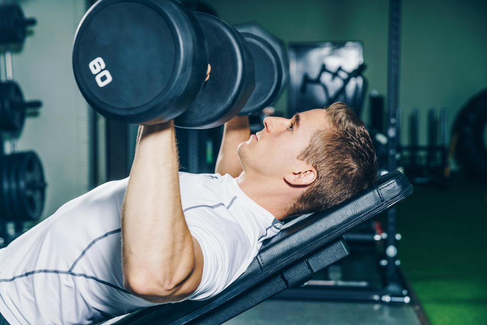 man lifting weights