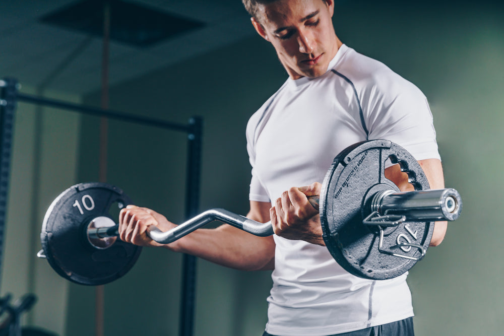 man lifts bar bell