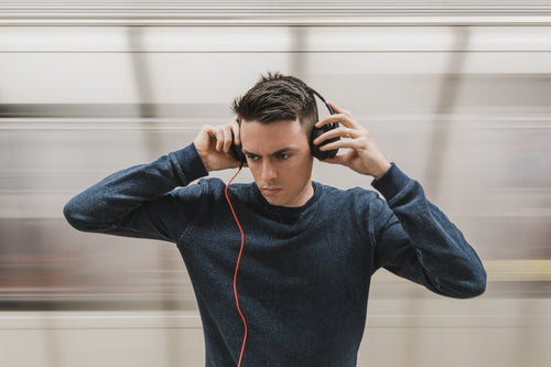 man listening to headphones