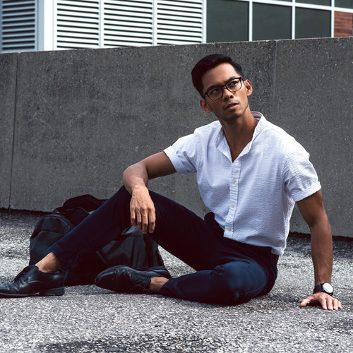 Man Poses On Roof Looking Up