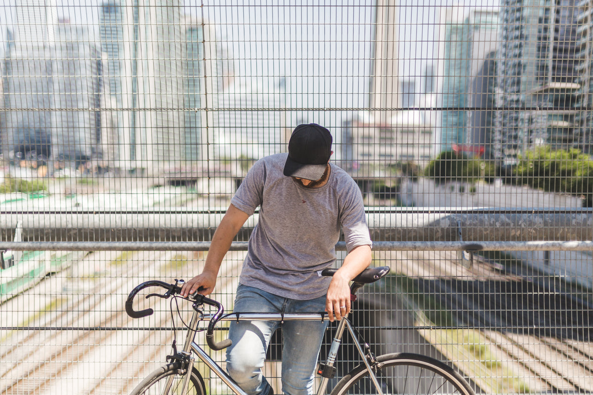 man posing with bike
