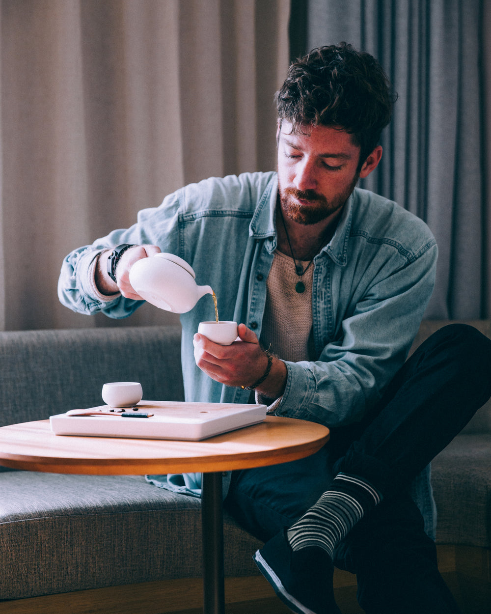 man pouring tea