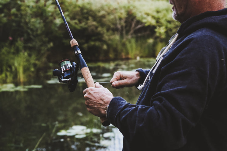 Man Reeling In On Fishing Rod