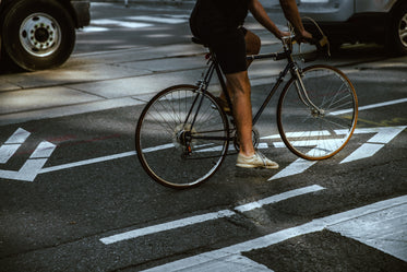 man riding in city bike lane