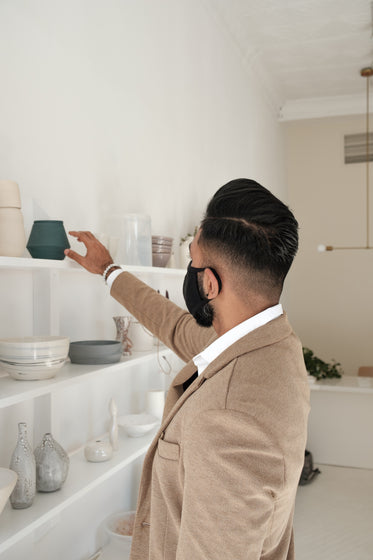 man shopping and wears black face mask