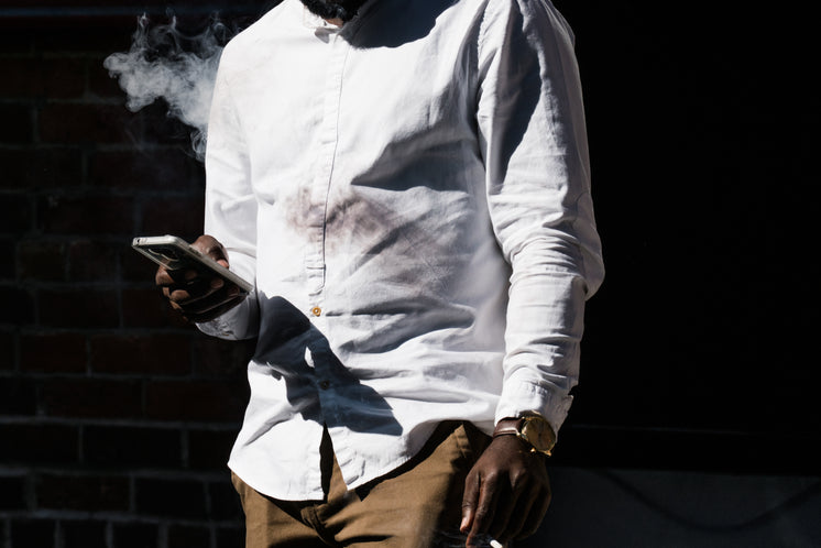 Man Smoking And Texting