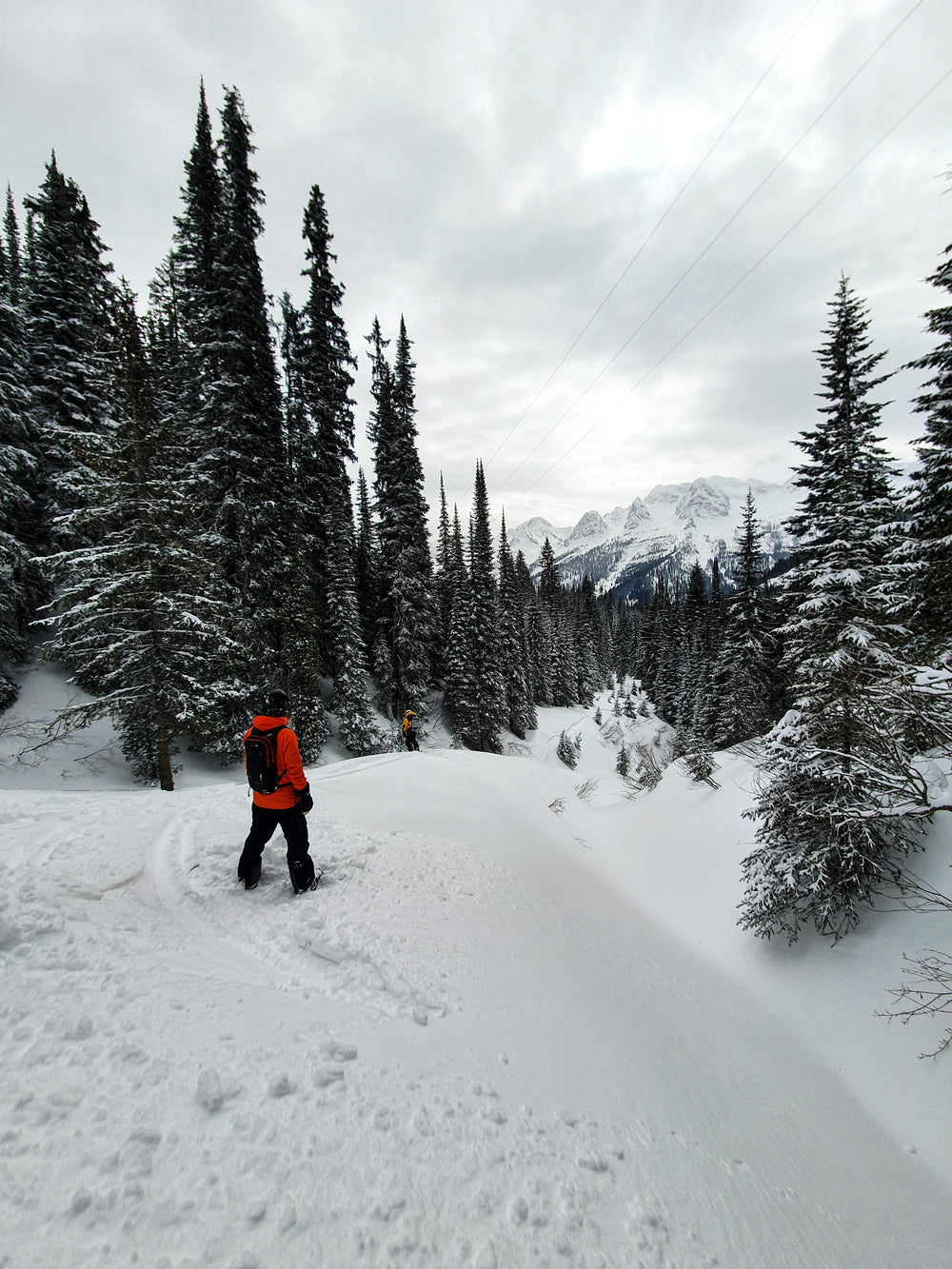 man standing alone on a snowy hill