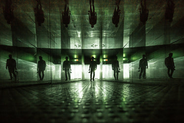 man standing with mirrored walls