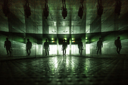 man standing with mirrored walls